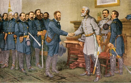 An image of Union general Ulysses S. Grant and Confederate commander Robert E. Lee at Appomattox Court House as they agree to terms of Lee’s surrender