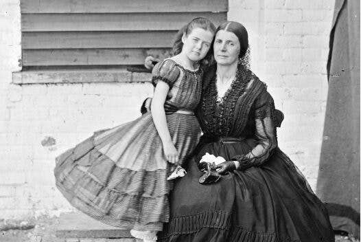 The photograph shows Rose Greenhow with her arm around her daughter.