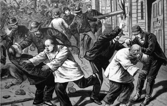 Image shows a crowd of American men beating Chinese men in the street and destroying their property.